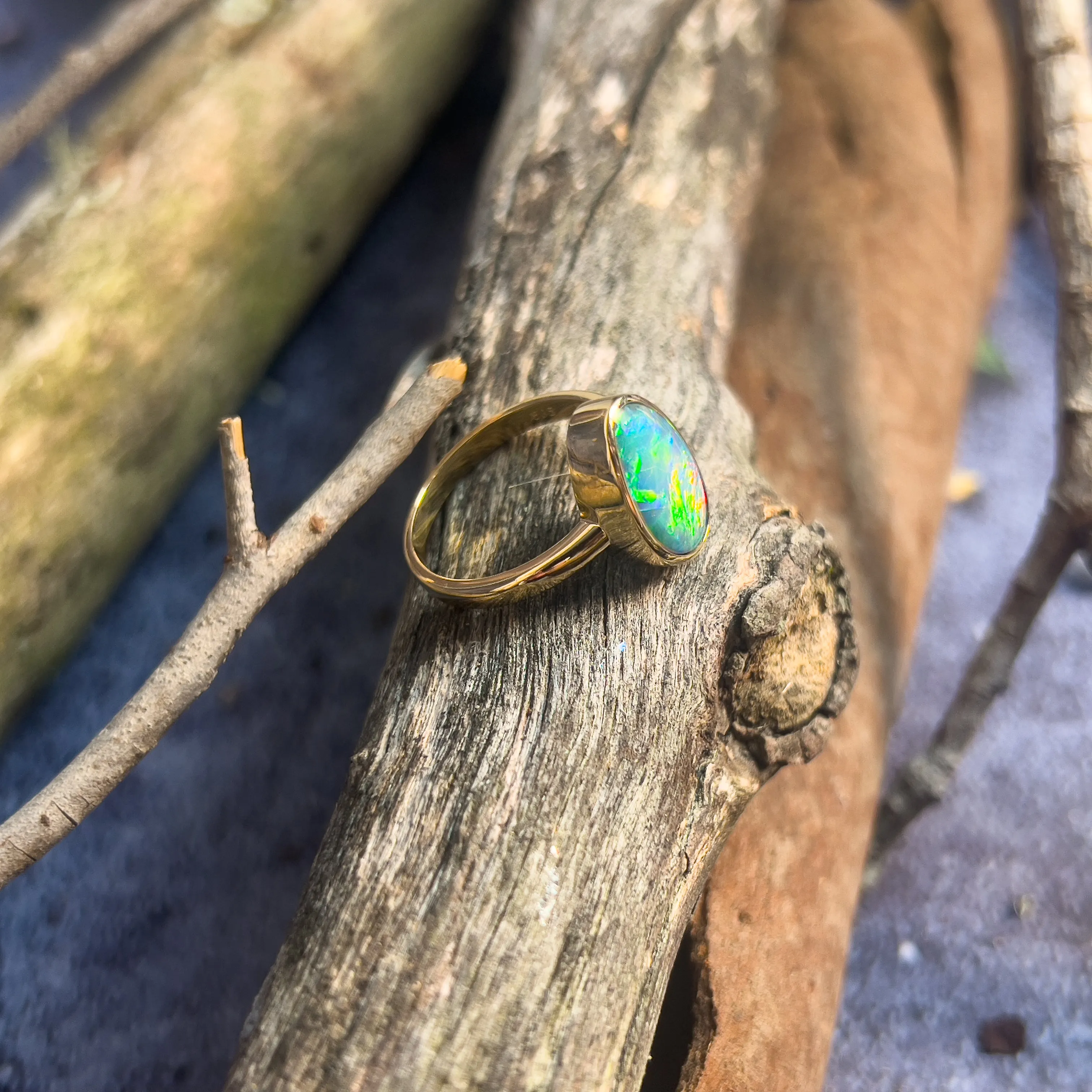 14kt Yellow Gold solitaire Black Opal 2.9ct doublet bezel set ring